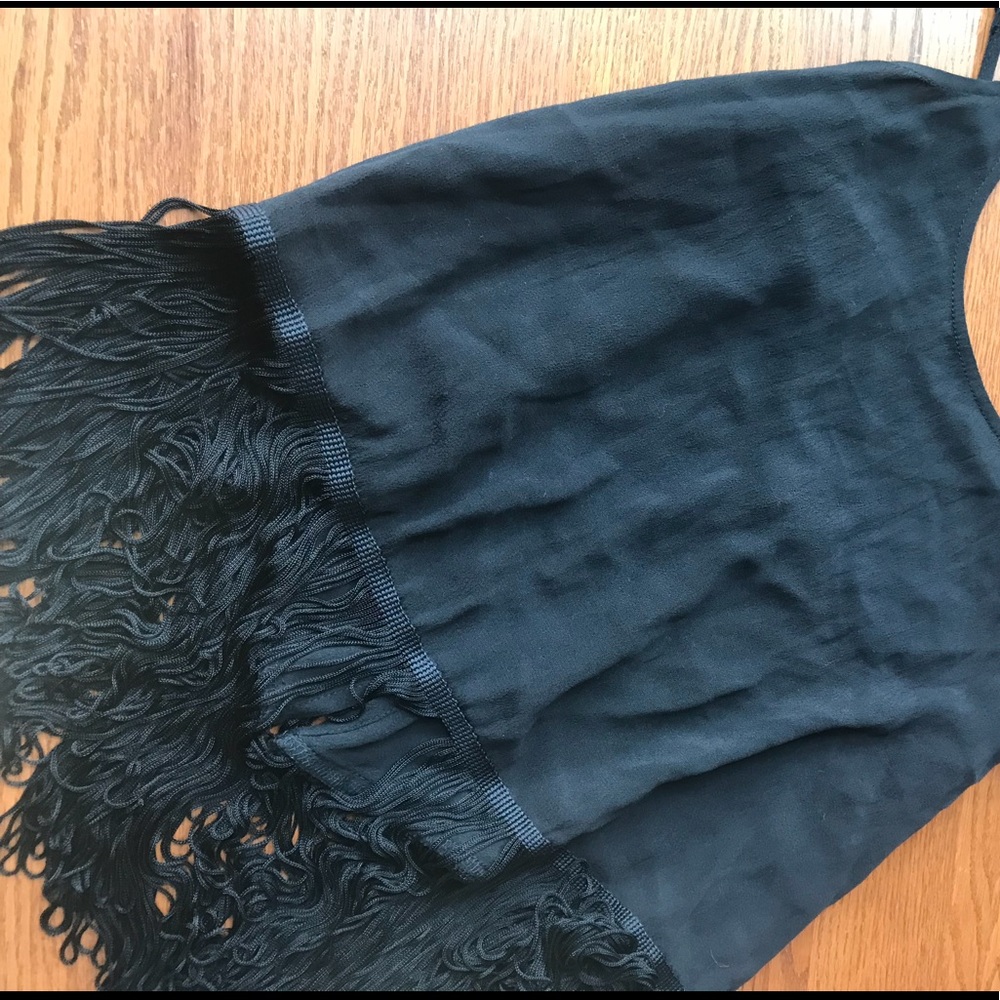 A black spaghetti strap with frills